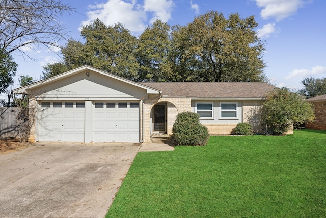 single story home featuring brick siding, a shingled roof, an attached garage, a front yard, and driveway