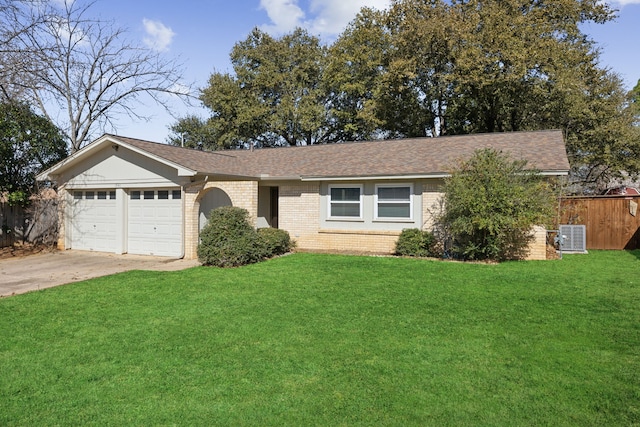 ranch-style home with brick siding, concrete driveway, an attached garage, a front yard, and fence