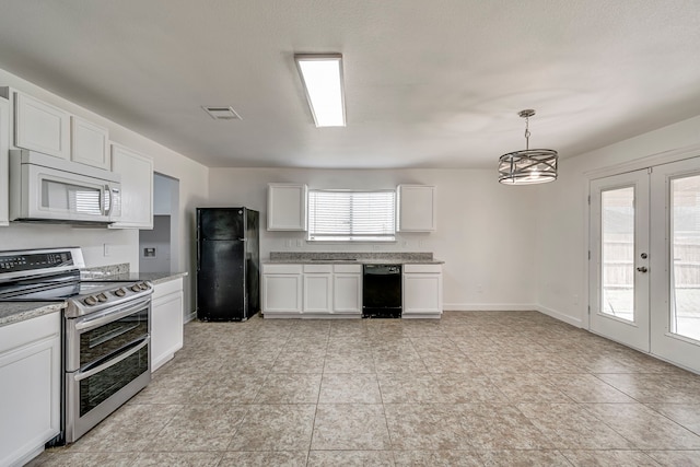 kitchen featuring double oven range, white microwave, freestanding refrigerator, french doors, and white cabinetry