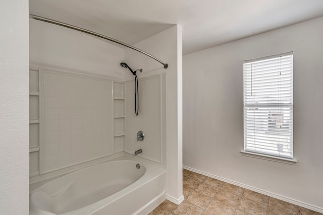 bathroom featuring shower / bathing tub combination and baseboards