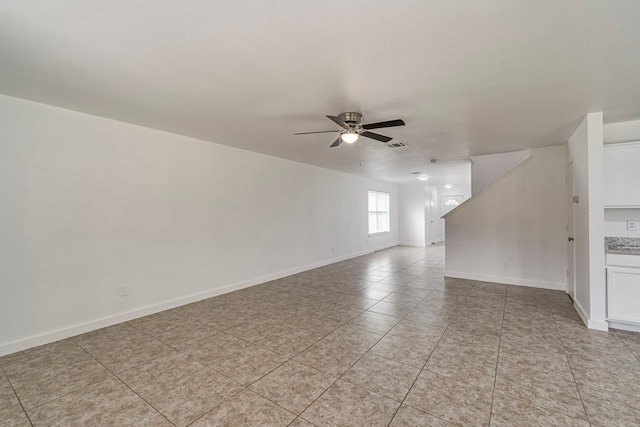 unfurnished room featuring visible vents, baseboards, ceiling fan, and light tile patterned flooring