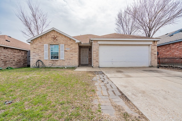 ranch-style house with a garage, brick siding, fence, driveway, and a front yard