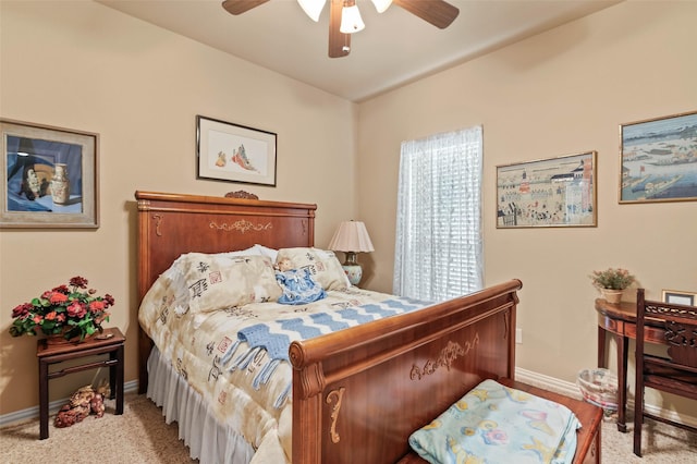 bedroom featuring baseboards, carpet floors, and a ceiling fan