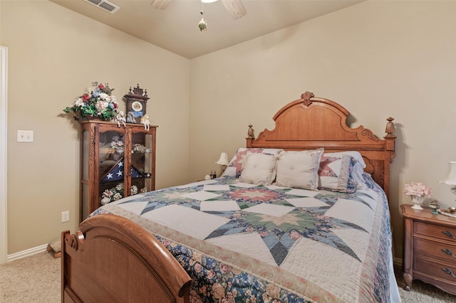 bedroom featuring visible vents, baseboards, a ceiling fan, and carpet flooring