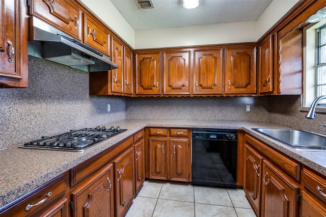 kitchen with visible vents, under cabinet range hood, dishwasher, stainless steel gas stovetop, and a sink