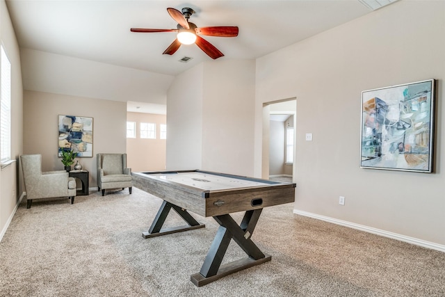 recreation room featuring vaulted ceiling, carpet flooring, visible vents, and baseboards