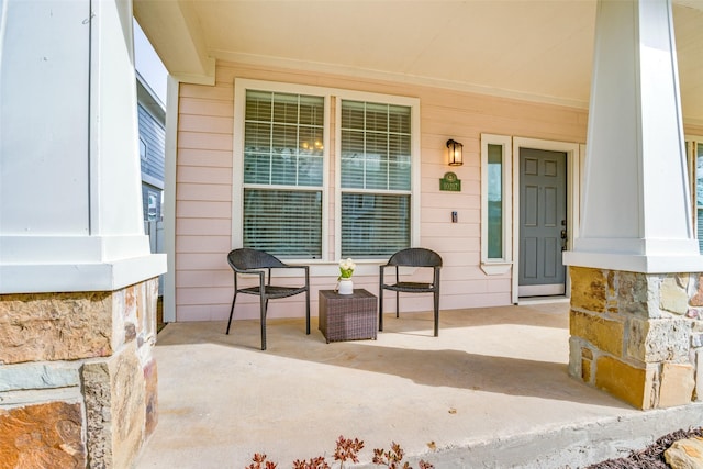 entrance to property featuring covered porch