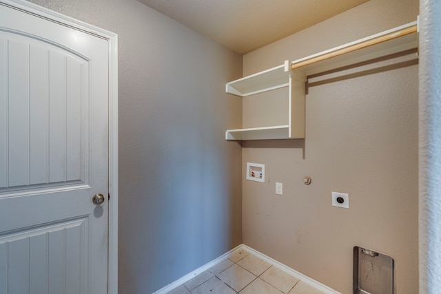 washroom featuring washer hookup, light tile patterned flooring, electric dryer hookup, laundry area, and baseboards