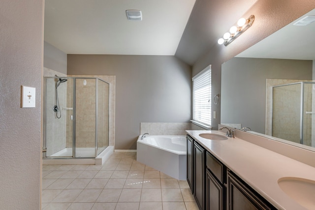 bathroom with a sink, a shower stall, a bath, and tile patterned floors