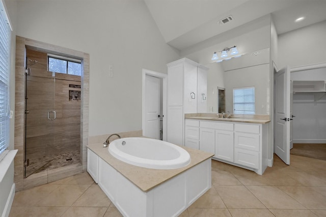 bathroom with visible vents, tile patterned floors, a garden tub, vanity, and a shower stall