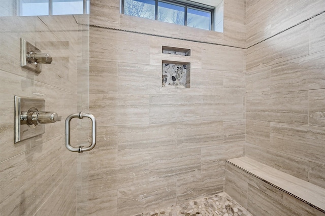 bathroom with tiled shower