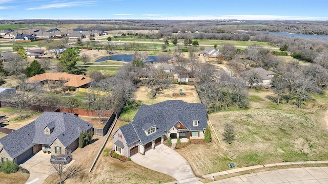 aerial view featuring a water view and a residential view