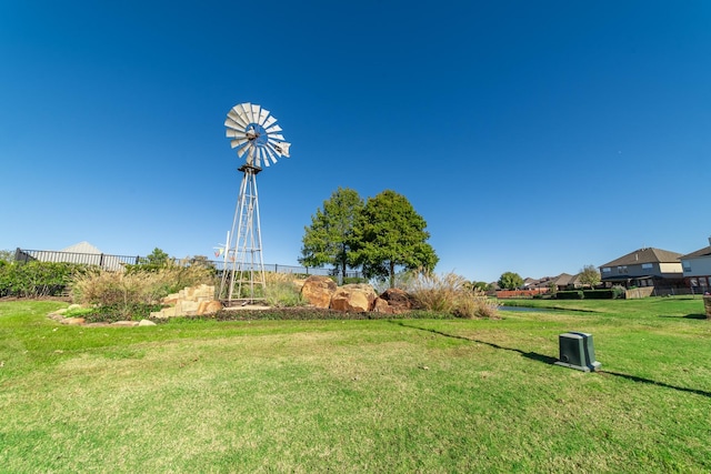 view of property's community with a lawn