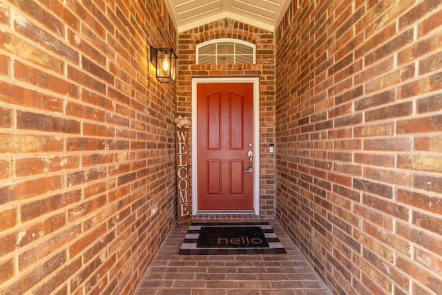 property entrance with brick siding