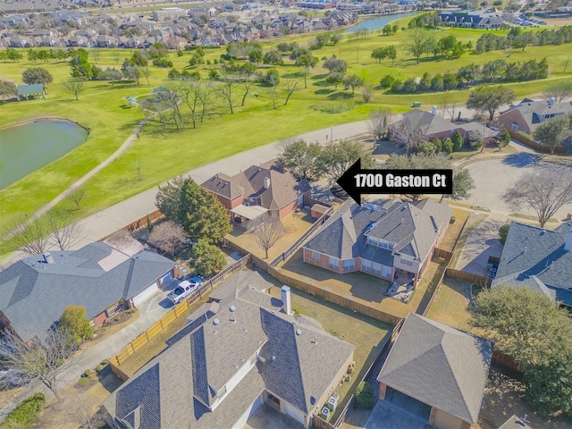 birds eye view of property featuring a water view, a residential view, and golf course view