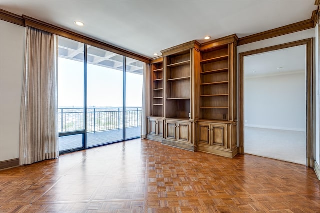 unfurnished living room featuring crown molding, floor to ceiling windows, recessed lighting, and baseboards