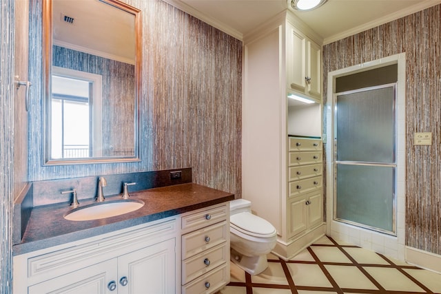 full bath featuring toilet, a stall shower, and crown molding