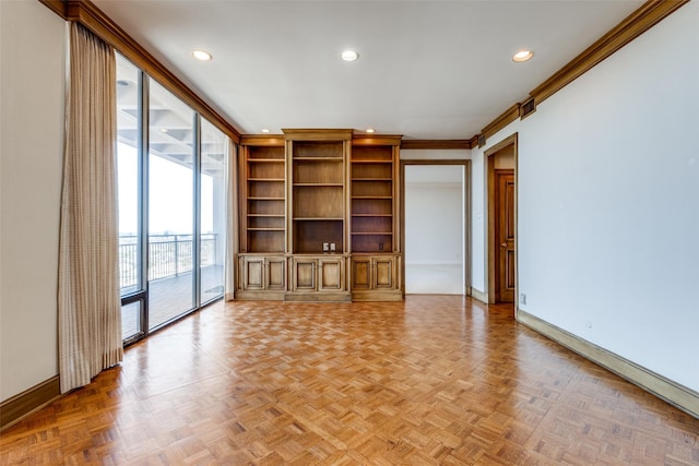 unfurnished living room with baseboards, crown molding, and recessed lighting