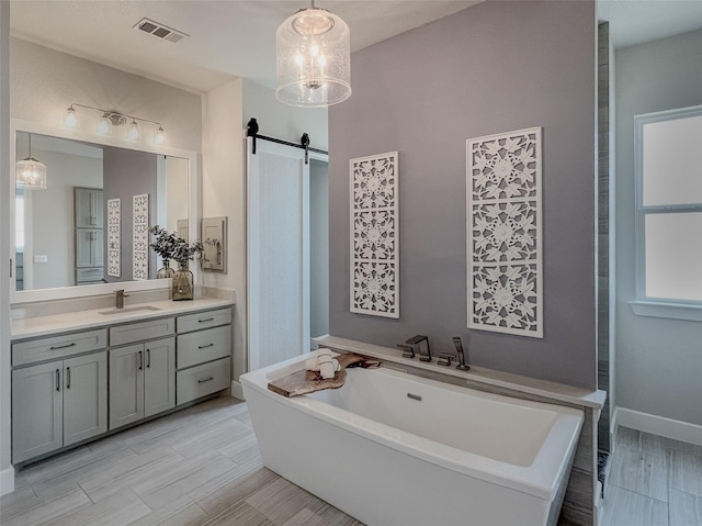 1000 Sutherland Cres, Northlake, TX 76247 - bathroom featuring vanity, a soaking tub, and baseboards