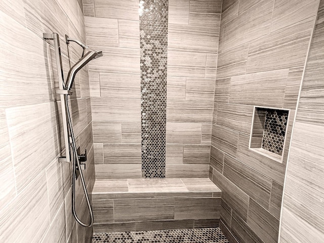 full bathroom with a tile shower