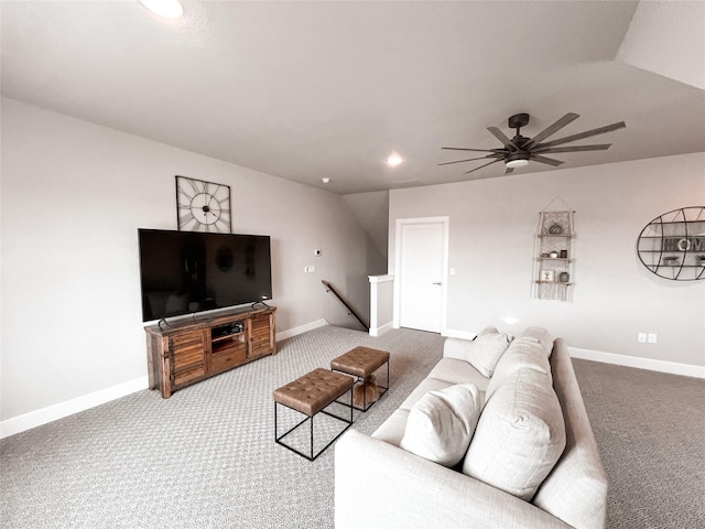 living room featuring a ceiling fan, lofted ceiling, carpet, and baseboards