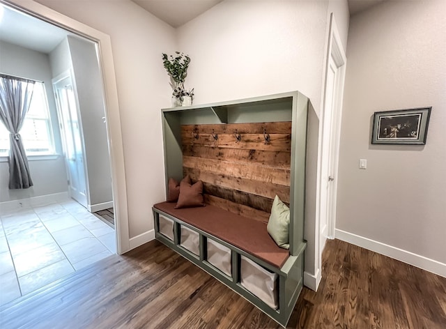 mudroom featuring wood finished floors and baseboards