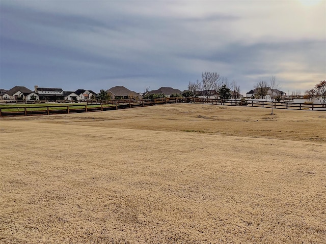 view of yard with a residential view, an enclosed area, and fence