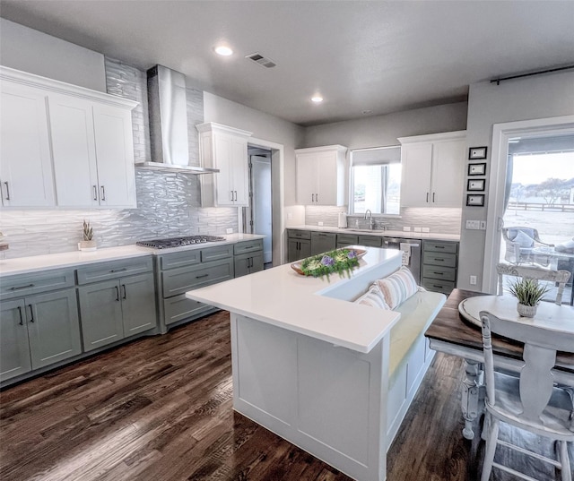 1000 Sutherland Cres, Northlake, TX 76247 - kitchen featuring wall chimney exhaust hood, a sink, appliances with stainless steel finishes, gray cabinetry, and a center island