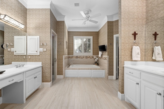 bathroom featuring a garden tub, a sink, ornamental molding, a shower stall, and wallpapered walls