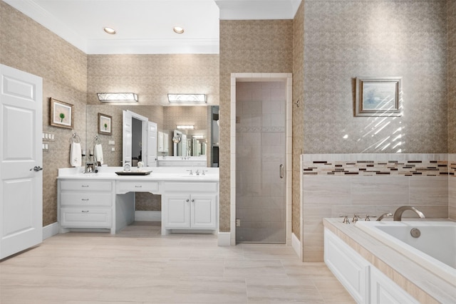 bathroom featuring wallpapered walls, a garden tub, a stall shower, and vanity