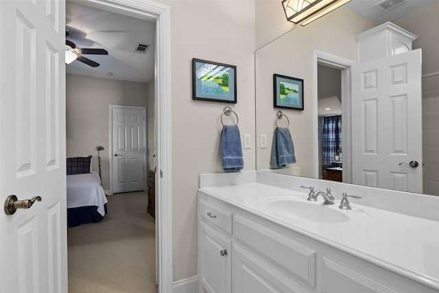 bathroom featuring a ceiling fan, visible vents, vanity, and ensuite bath