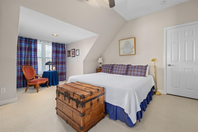 bedroom featuring a ceiling fan, carpet, vaulted ceiling, and baseboards