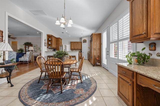 dining area featuring light tile patterned floors, recessed lighting, baseboards, visible vents, and ceiling fan with notable chandelier