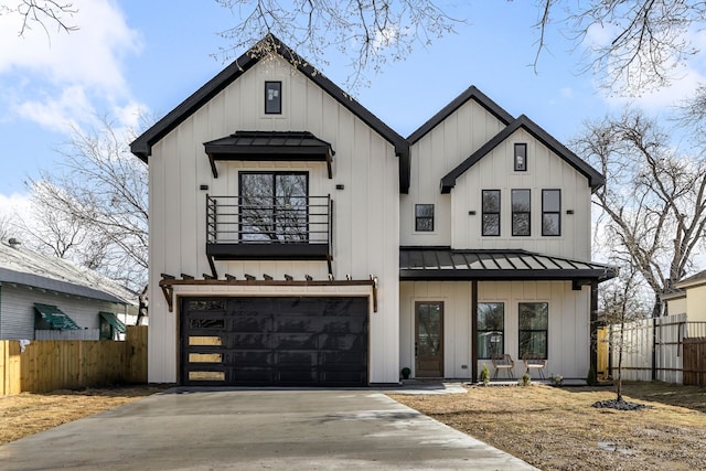 modern farmhouse style home with a standing seam roof and board and batten siding