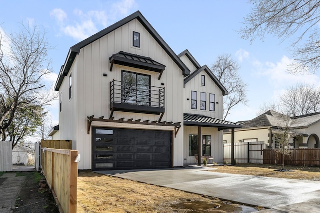 modern inspired farmhouse featuring driveway, a balcony, a standing seam roof, fence, and board and batten siding