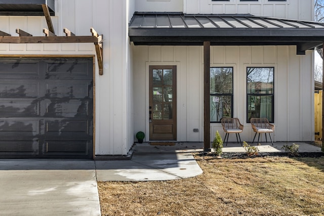 property entrance featuring board and batten siding, a standing seam roof, and metal roof