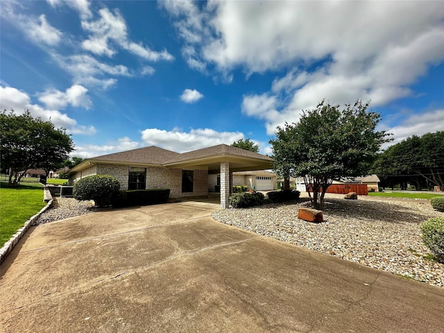 4227 Mojave Dr, Granbury, TX 76049 - single story home with concrete driveway and brick siding