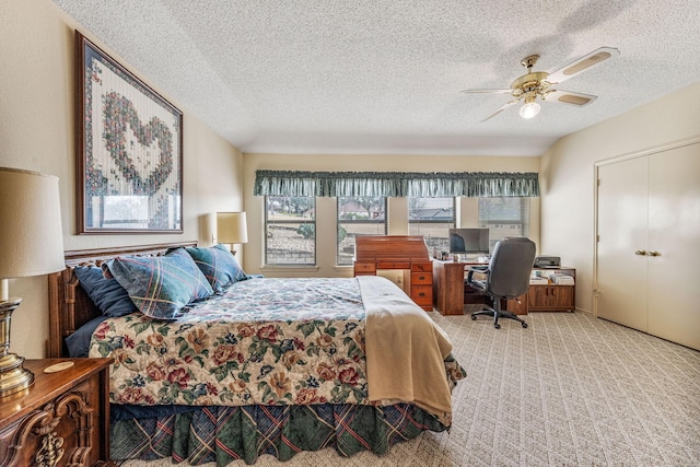 4227 Mojave Dr, Granbury, TX 76049 - carpeted bedroom featuring a textured ceiling, a desk, ceiling fan, and a closet