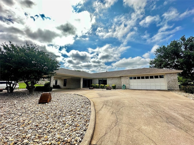 4227 Mojave Dr, Granbury, TX 76049 - single story home featuring driveway, a garage, and brick siding