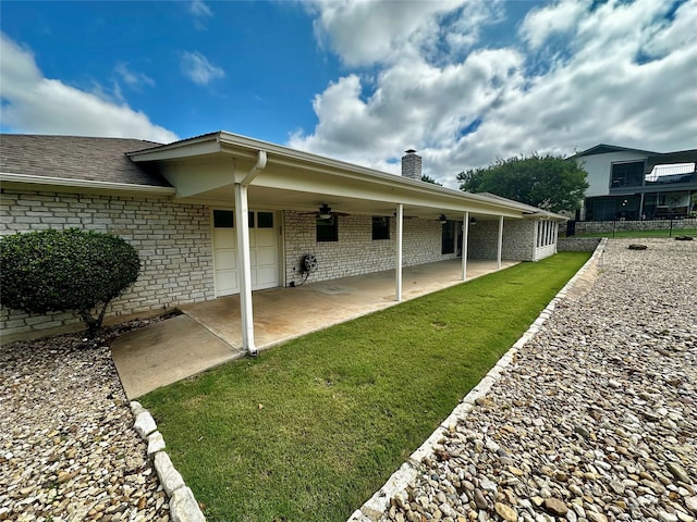 4227 Mojave Dr, Granbury, TX 76049 - back of property with brick siding, a ceiling fan, a patio, and a chimney