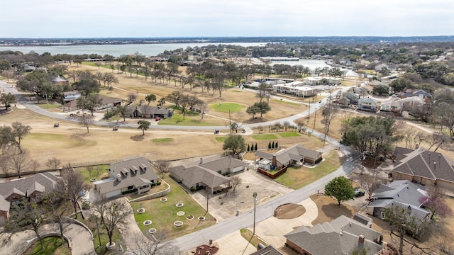 birds eye view of property featuring a water view and a residential view