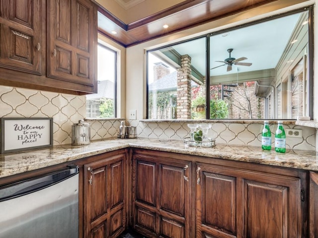 kitchen featuring dishwasher, ceiling fan, tasteful backsplash, and light stone countertops