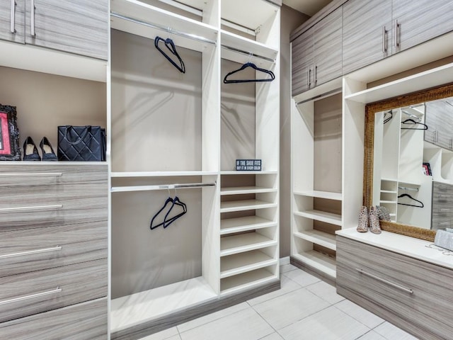 walk in closet featuring light tile patterned floors