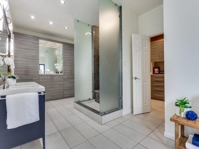 full bathroom featuring recessed lighting, a shower stall, tile patterned flooring, and vanity