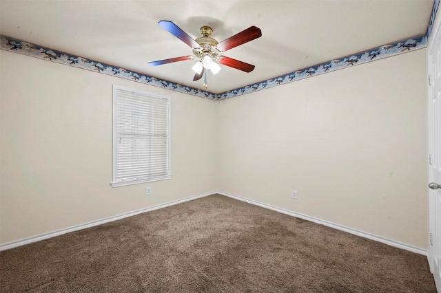 empty room featuring ceiling fan, carpet flooring, and baseboards