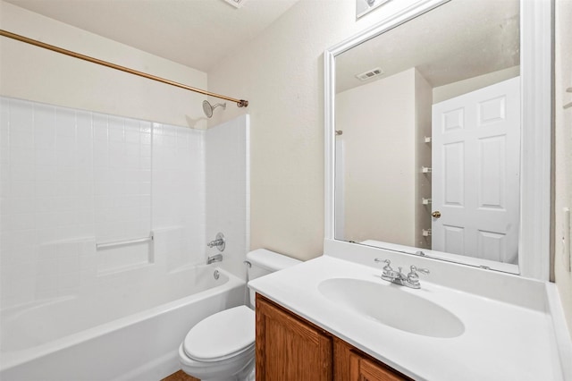 bathroom featuring toilet, visible vents, shower / washtub combination, and vanity