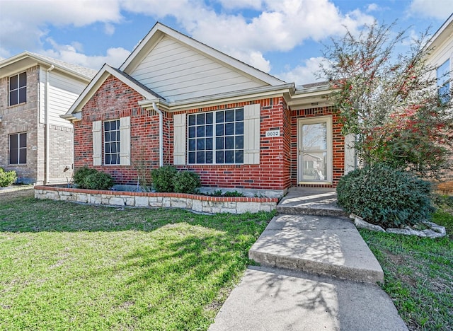 single story home with brick siding and a front lawn