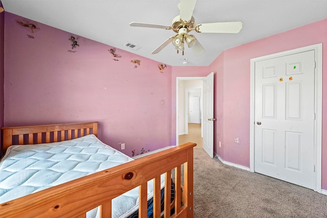 bedroom with a ceiling fan, carpet flooring, visible vents, and baseboards