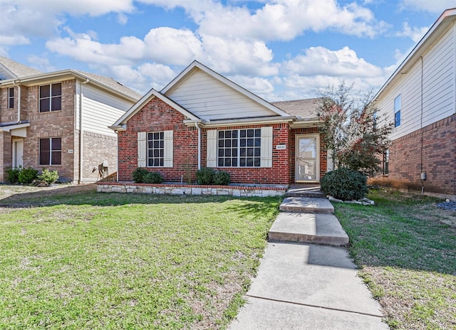 view of front of property with brick siding and a front lawn