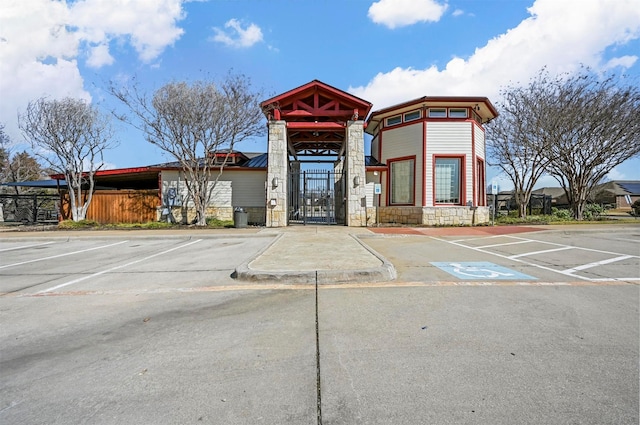 view of building exterior with uncovered parking